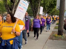 Some of the many unions represented at a rally calling on Starbucks to stop union busting. Photo credit: Karen Strickland